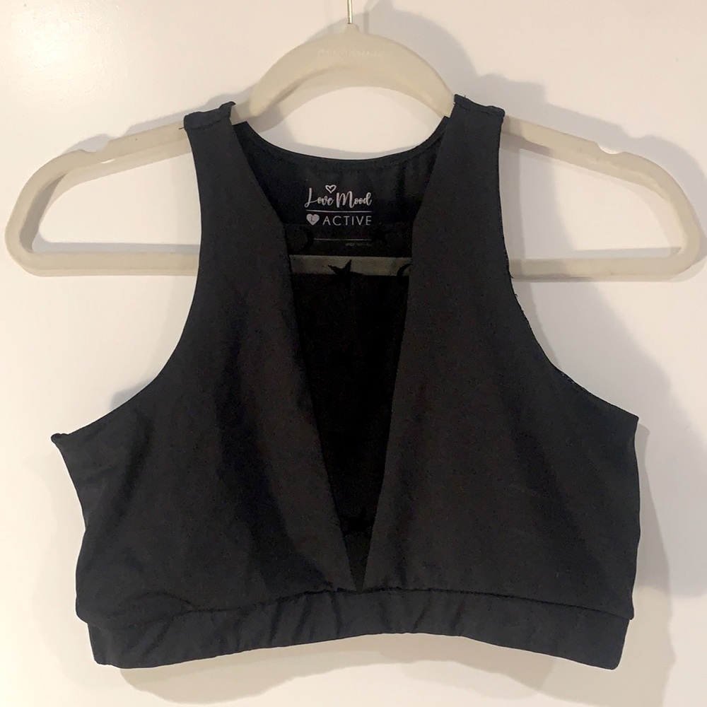 Black active top. Size large. Star and moon detailing